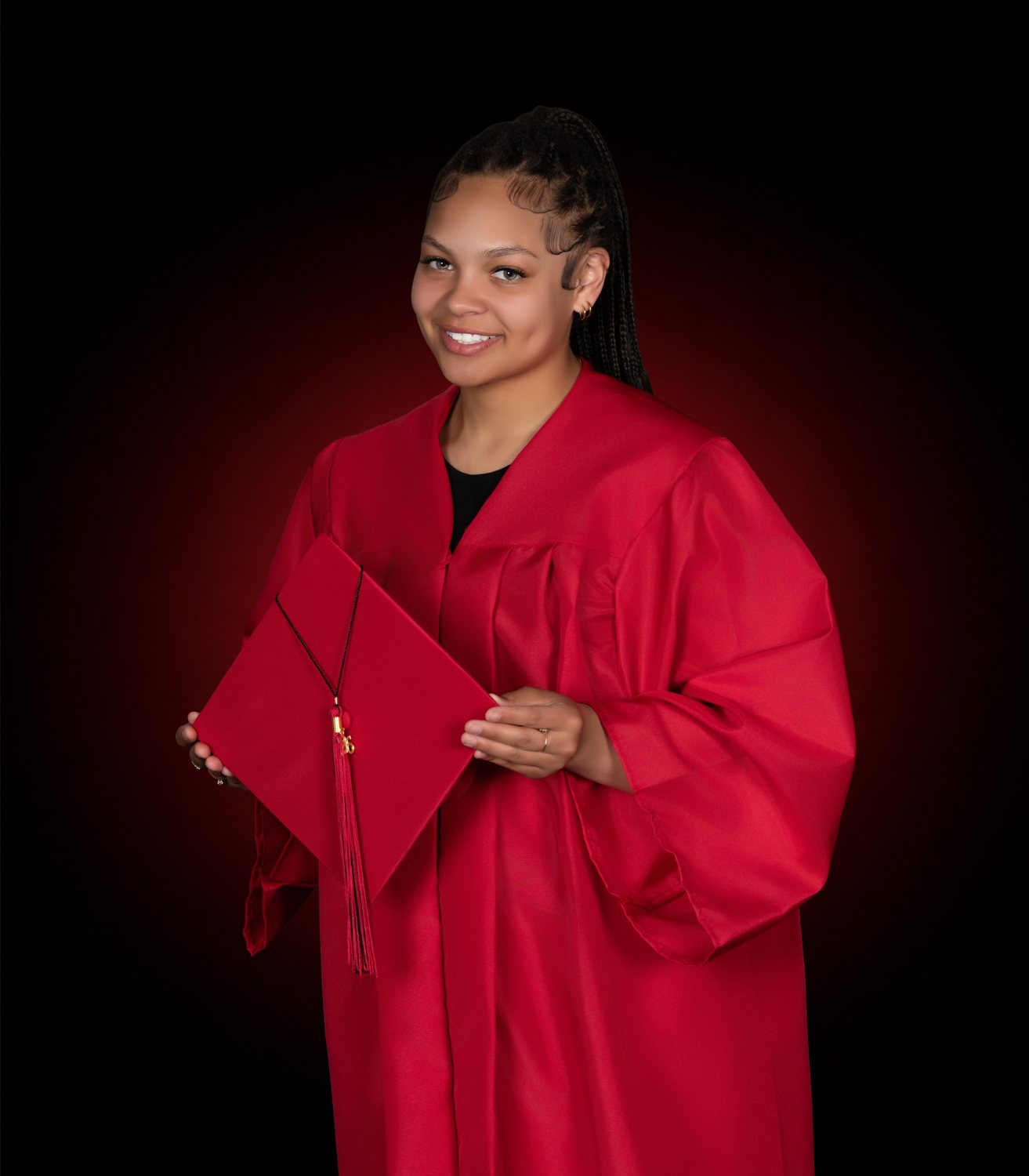 Graduate in cap and gown — DLS Innovations graduation portrait