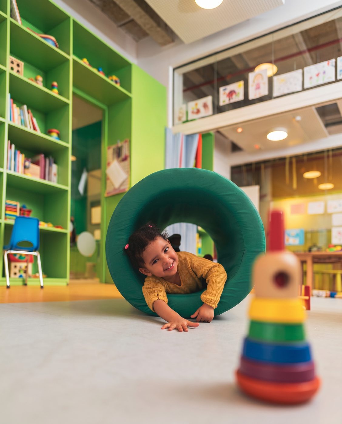 Toddler playing in a daycare classroom — DLS Innovations daycare photography