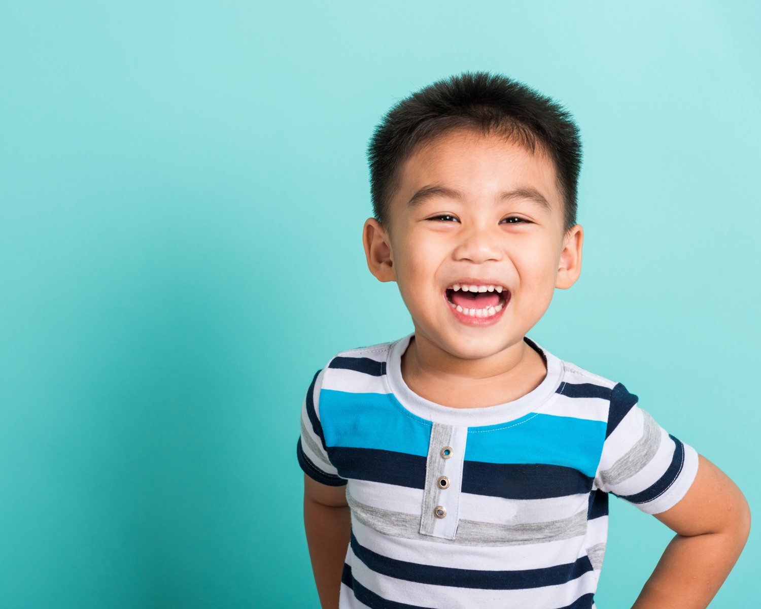 Smiling student with a backpack in a school library — DLS Innovations school photography