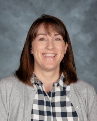 Friendly staff portrait for flexible preschool scheduling