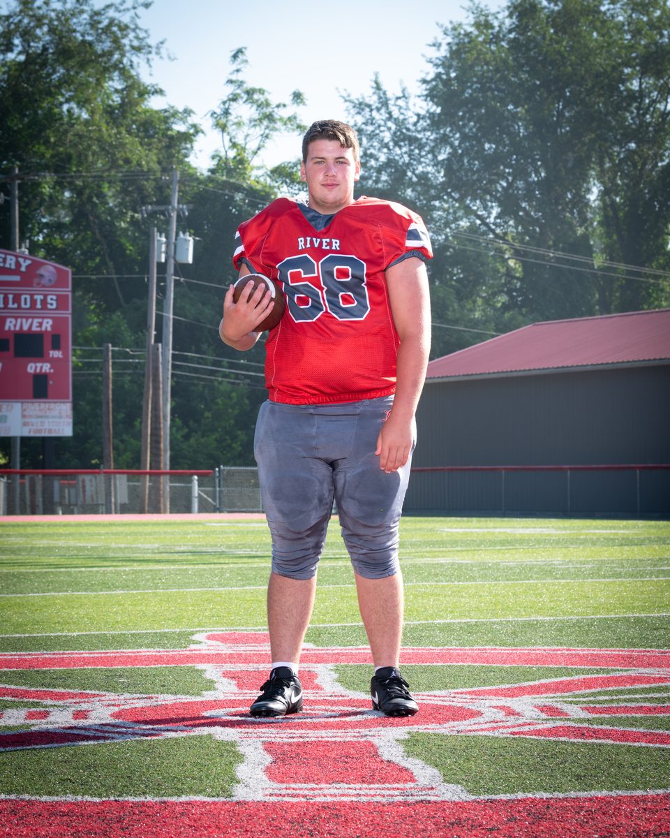 A DLS Innovations sports portrait of a River High School football player on the field